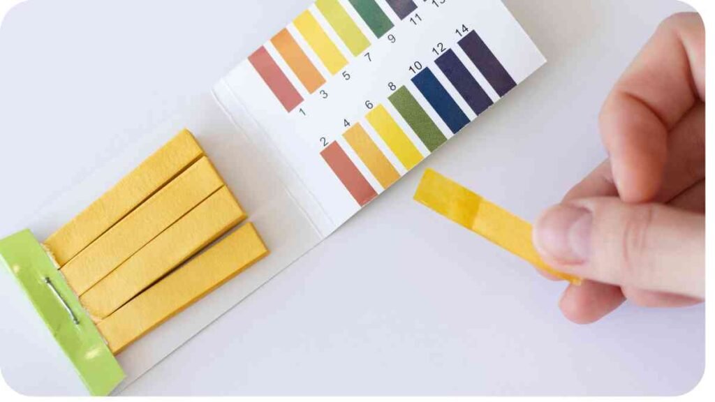 a person is using a test strip to measure the color of a piece of paper